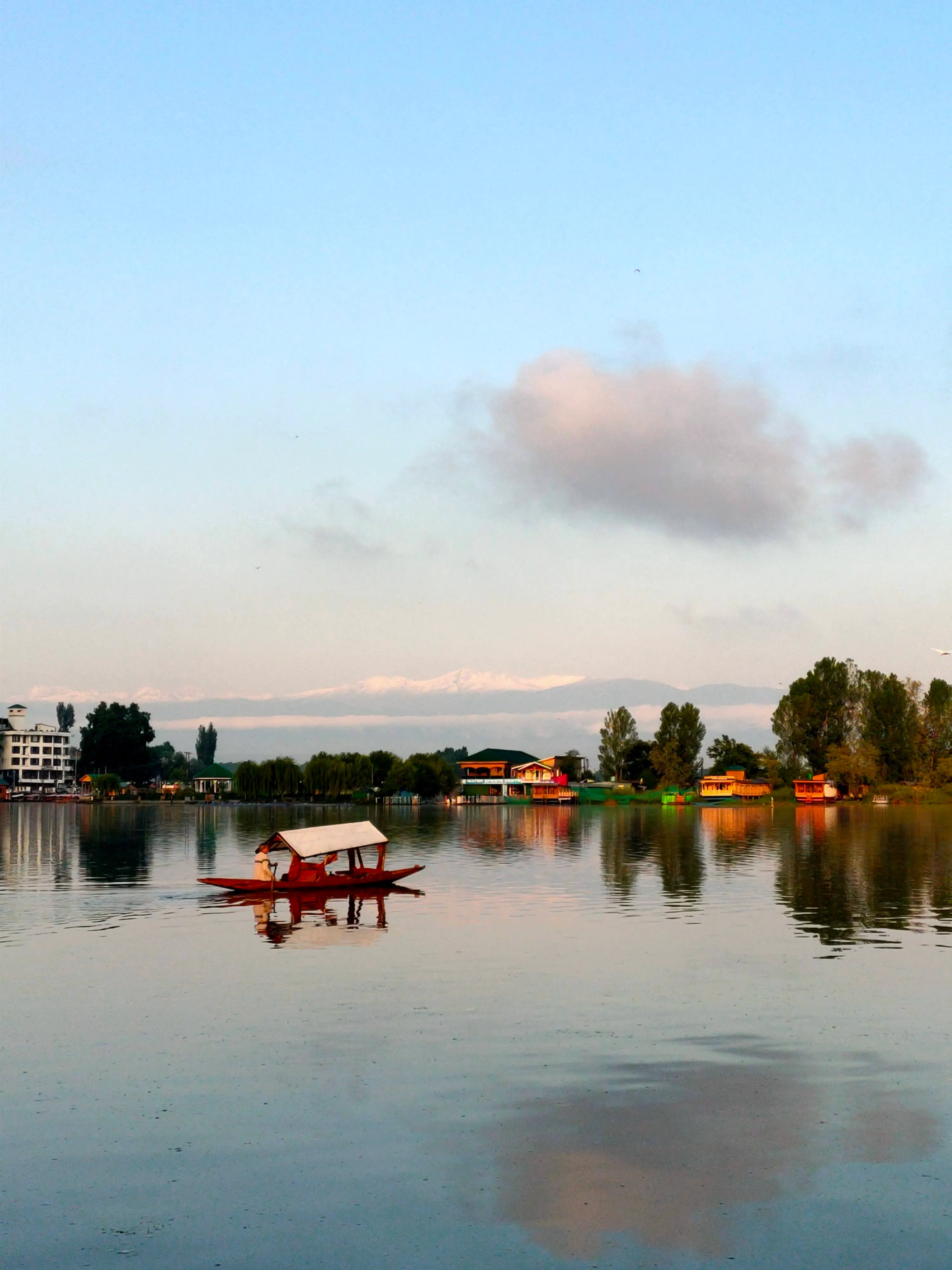 A calm lake surrounded by hills in Kashmir